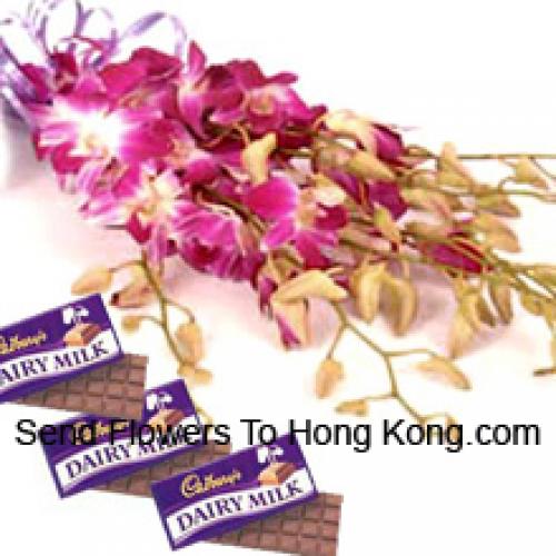 Carini orchidee rosa con cioccolatini Cadbury